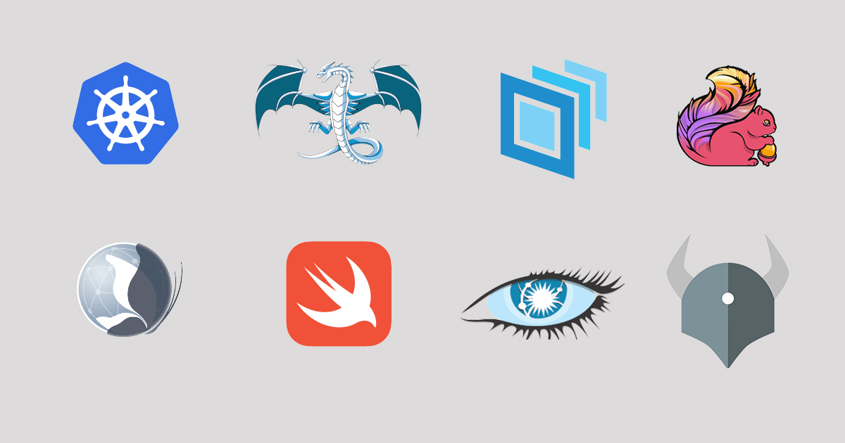 Developers collaborating with sticker-covered laptop