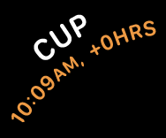 Two lines of text, both of which appear to follow the curve of the top-left quadrant of a circle. The top line contains the word cup in large white text. The bottom line contains the time ten oh nine AM followed by a plus sign and zero hours, all in orange text.