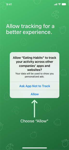 A screenshot of an app’s pre-tracking message that reads ’Allow tracking for a better experience.’ The app’s custom screen also includes an upward-pointing arrow and the words Choose Allow in the lower third of the screen. Because the system-provided alert displays on top of the custom screen, the arrow appears to be pointing to the alert’s Allow button.