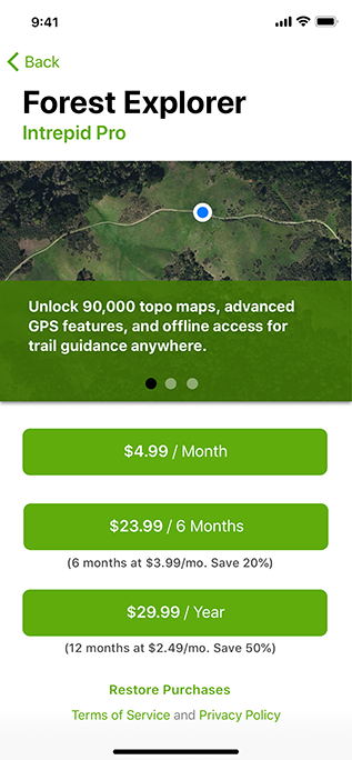 Screenshot of an app named Forest Explorer running on iPhone. The first of three page views is displayed in the top half of the screen, showing part of a satellite map of a forested area and including a location indicator. Below the page view area are three buttons, each of which displays a different payment option, such as $23.99 for six months, and describes the savings for that option, if applicable. A button titled Restore Purchases appears at the bottom of the screen, followed by a button for Terms of Service and Privacy Policy.