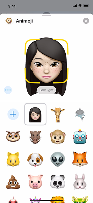 A screenshot of the Animoji recording sheet on iPhone. The app displays the message low light to help the user understand that more light is required for a high quality recording.