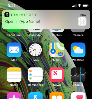 Image of a notification banner at the top of the device screen that gives users an opportunity to open a specific app to process the tag data that was scanned in the background.