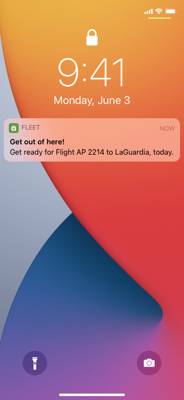 A screenshot of the lock screen on iPhone, showing a notification about an upcoming flight.
